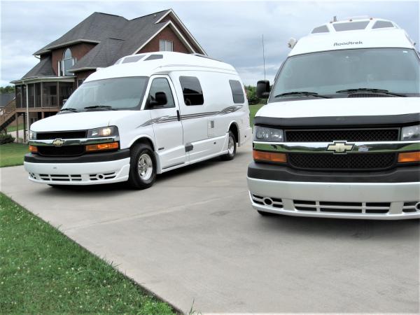 2007 Roadtrek 210 Versatile on right and 2016 Roadtrek 210 Popular on left.