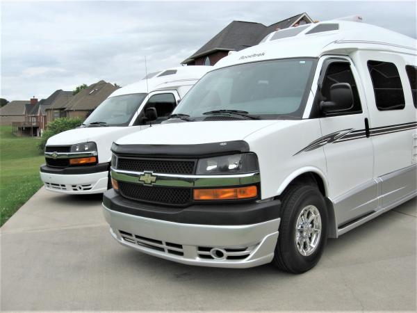 2007 Roadtrek 210 Versatile on right and 2016 Roadtrek 210 Popular on left.