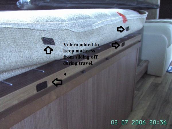 Velcro on Mattress to keep it from falling off into the floor when traveling down the road.  The bouncing down the road moves the mattress that sets on top of the plastic box springs.